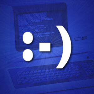 An emoticon on top of a DEC VT-100 terminal in blue.