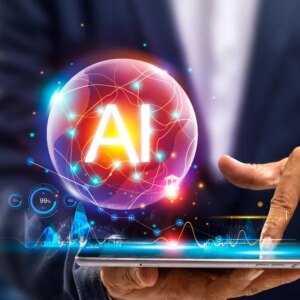 A man using a tablet and a sphere hologram with AI in it above the tablet