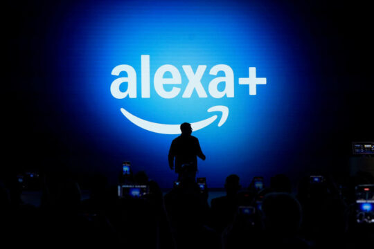 Alexa+ logo with a person standing in front of it