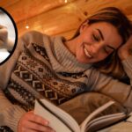 A smiling blonde woman reads in bed at night. In the top left foreground, a circular frame features a close up of the woman's hands using ChatGPT for sleep advice.