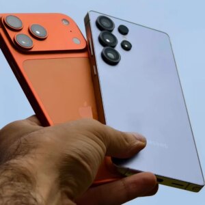 Prakhar Khanna holding the iPhone 17 Pro Max and Galaxy S25 Ultra.