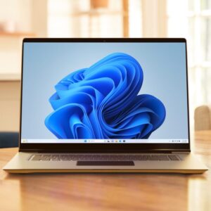 A laptop PC running Windows 11 sitting next to a coffee mug.