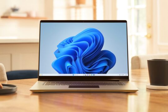 A laptop PC running Windows 11 sitting next to a coffee mug.