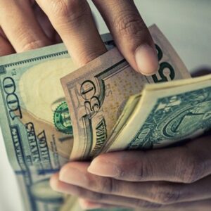 A man counting money by hand