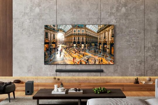 LG's 83-inch OLED B5 2025 TV. mounted onto a gray wall.