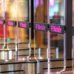 Clear plastic security gates with the T-mobile logo on them.