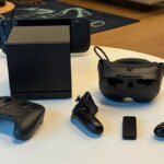 Valve's lineup of 2026 products in black: Steam Machine, Steam Controller, Steam Frame and Steam Deck in view on table